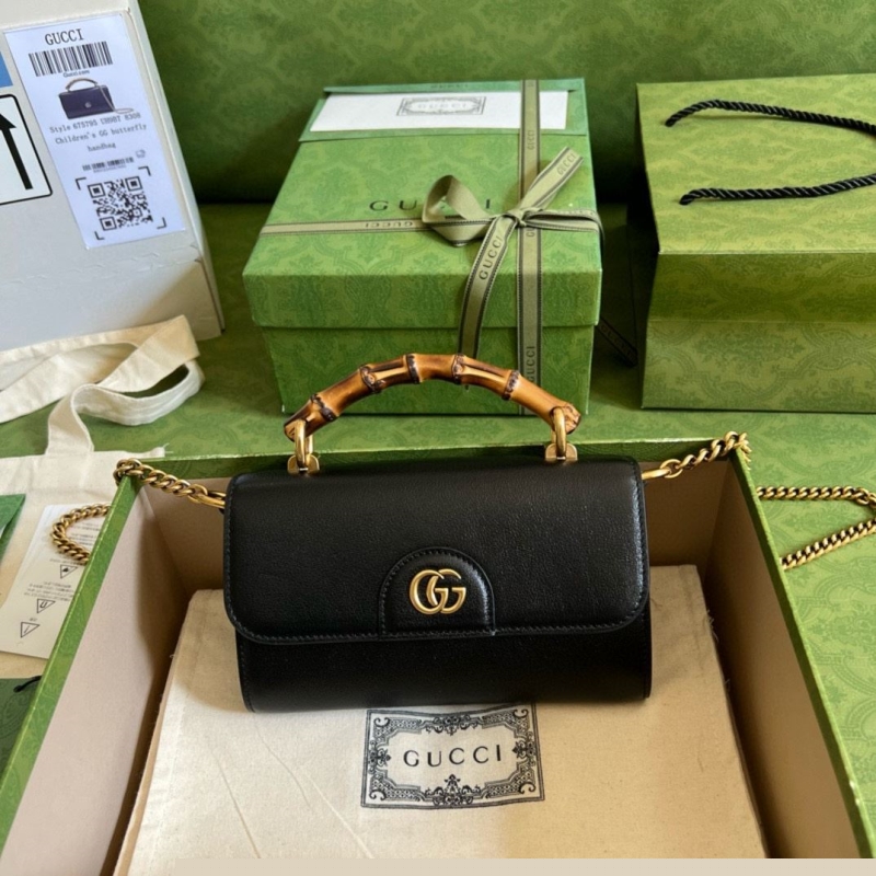 G*u*i top handle bags